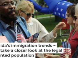 New U.S. citizens receive congratulations and flags following a naturalization ceremony in Winter Park, Fla. Photo by Paul Hennessy/NurPhoto via Getty Images